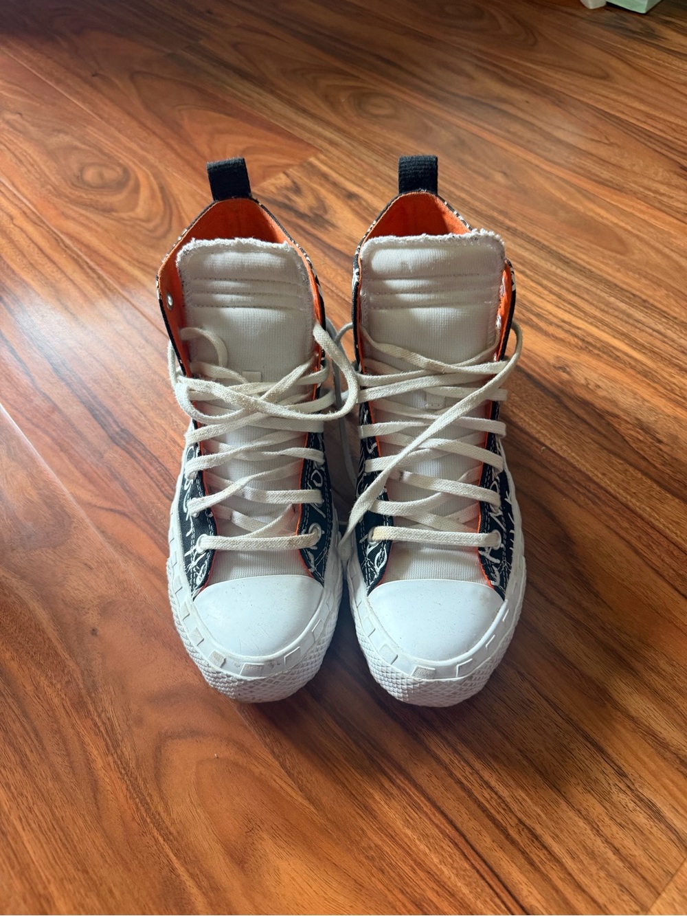 Chuck Taylors Converse in White, Black & Orange